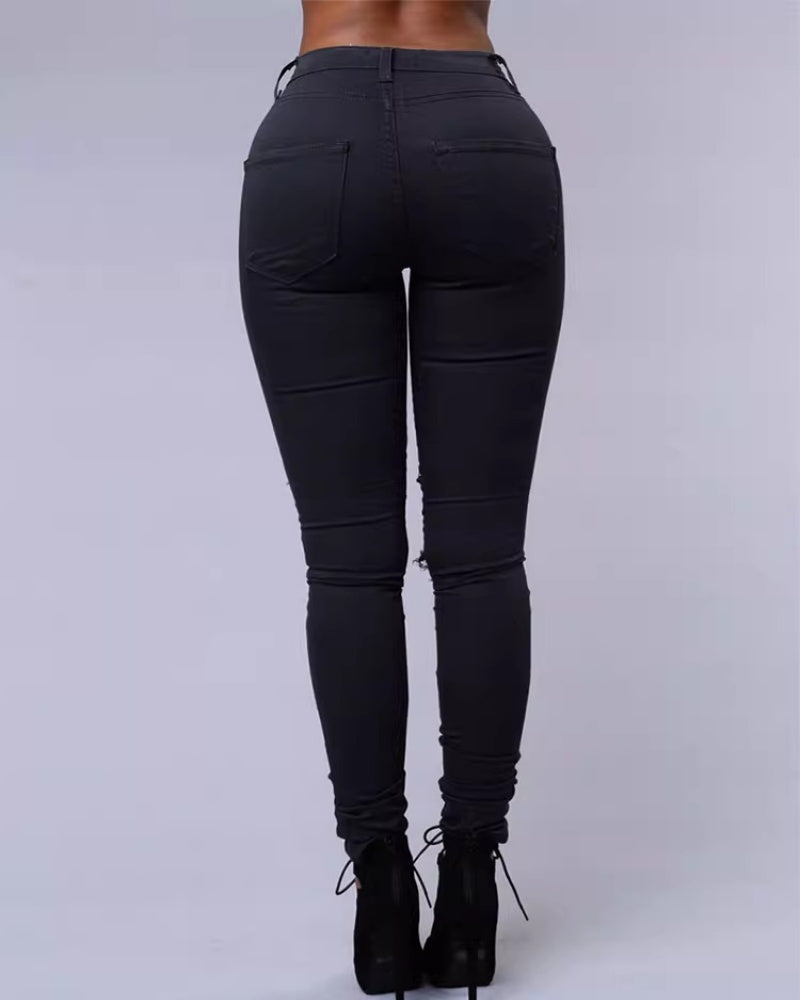 Jeans ajustados rasgados de tiro alto con elasticidad