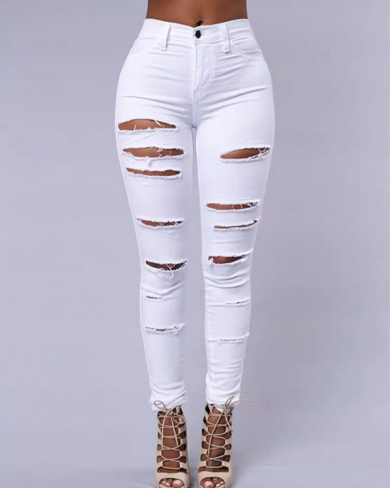 Jeans ajustados rasgados de tiro alto con elasticidad